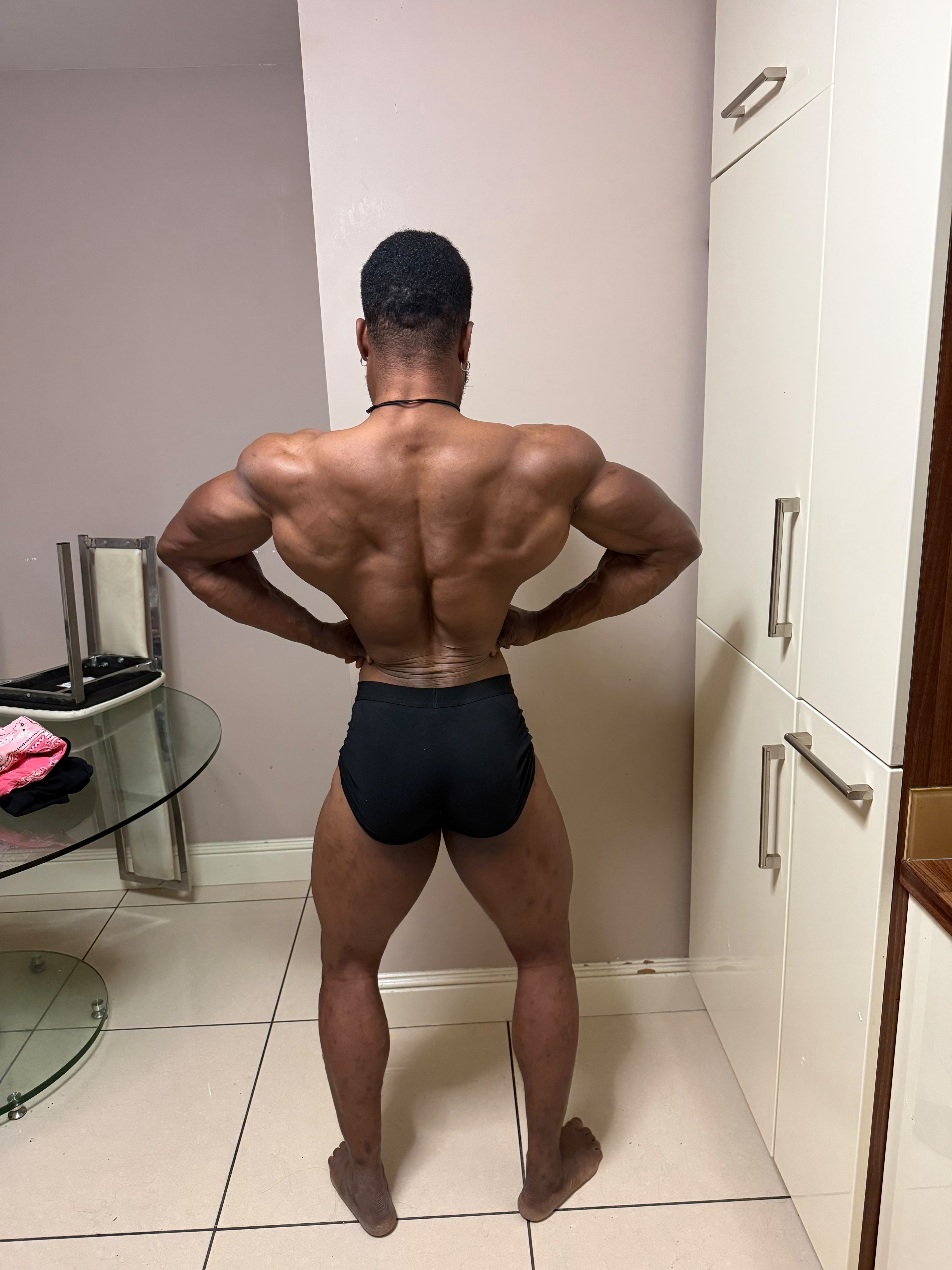 Christian Ebor in competition condition, back double-biceps pose
